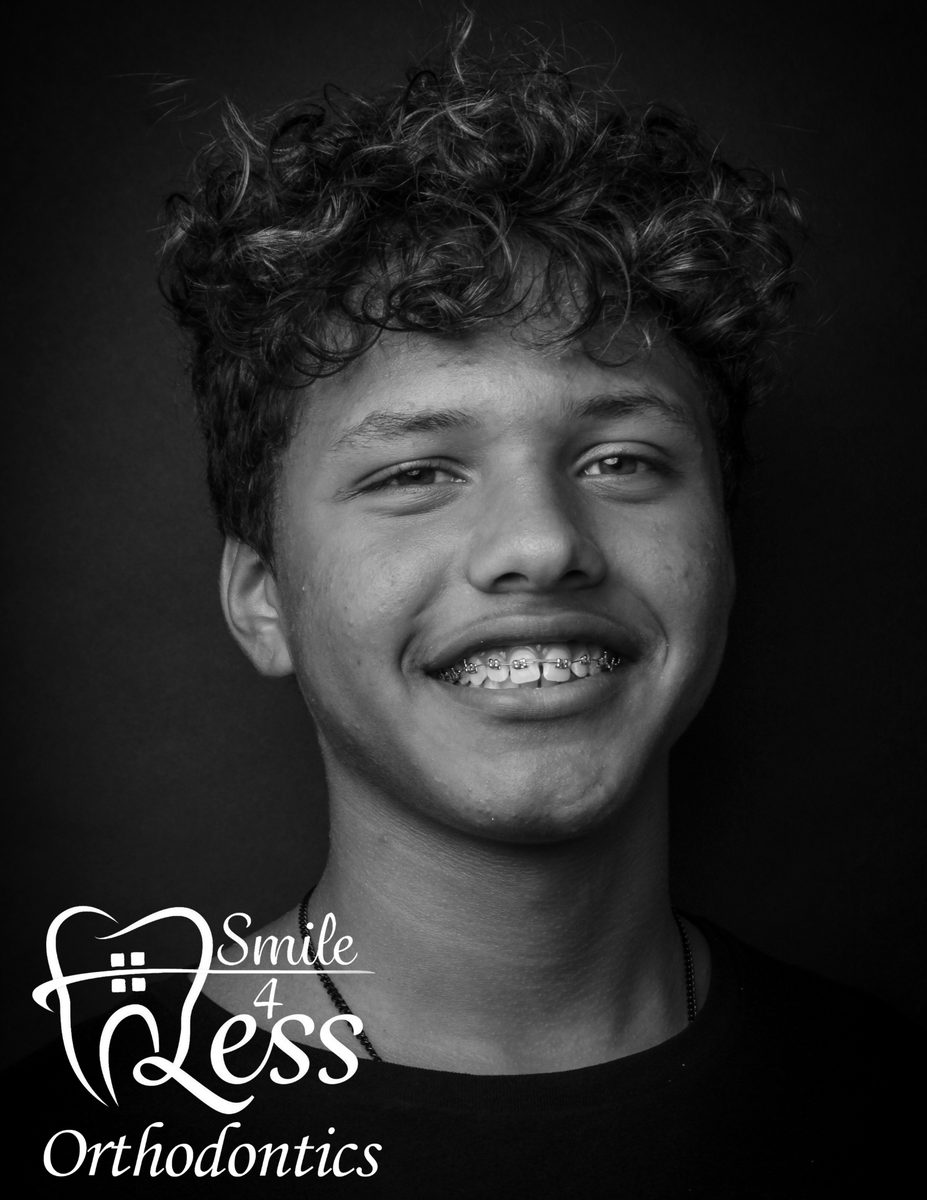 Teen with braces, black and white