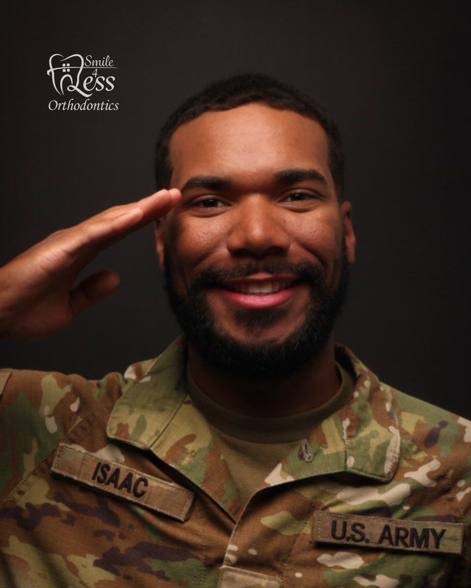 Soldier saluting and smiling